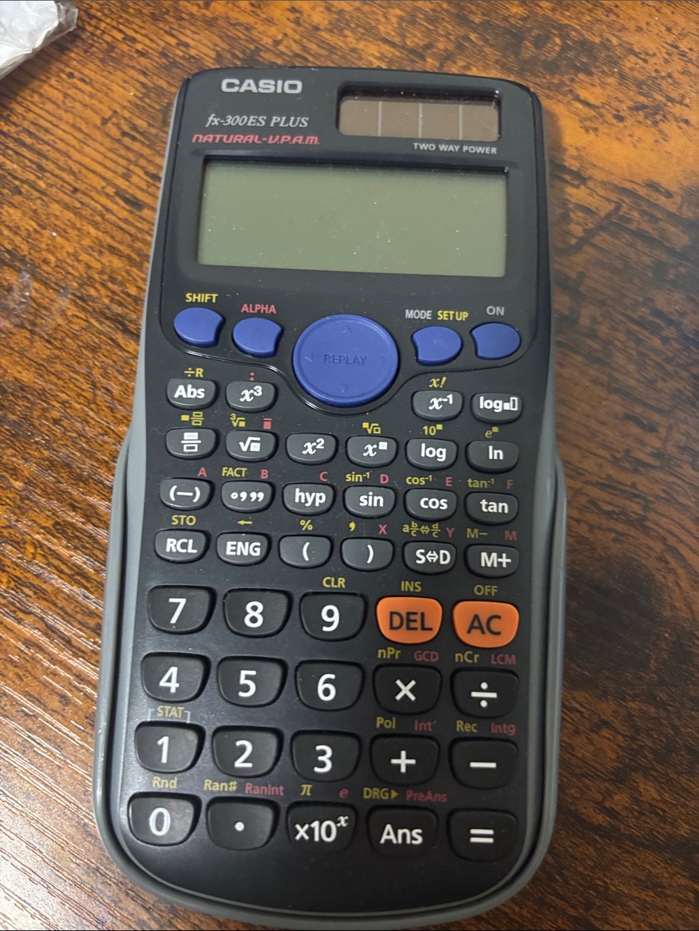 Casio Scientific Calculator in Black with Blue and Orange Accents